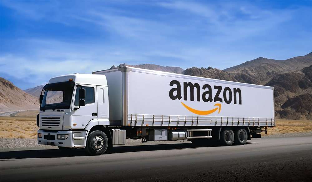 Amazon semi-truck transporting freight along a highway as part of a commercial delivery operation.

